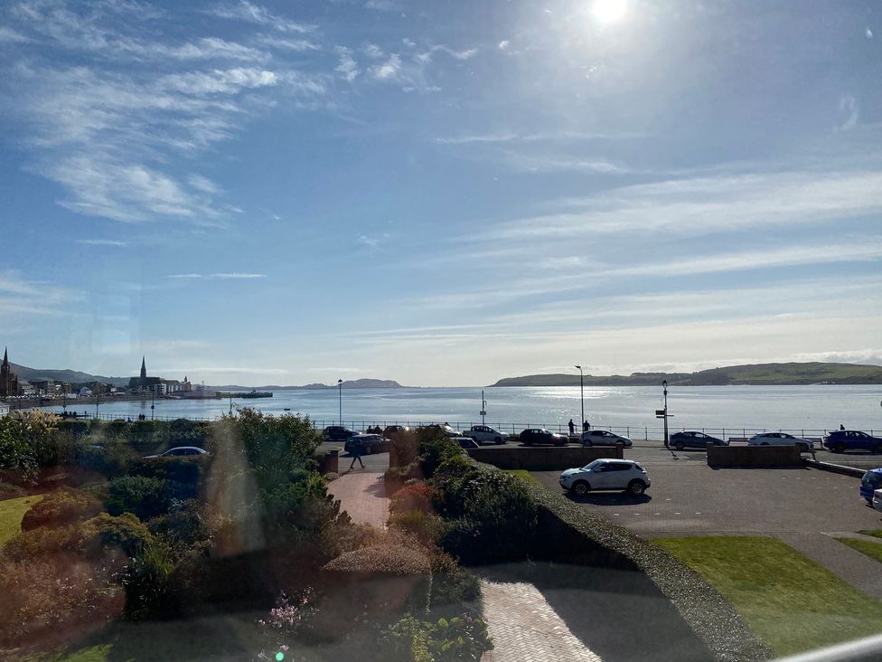 A view of the sea and cars along the promenade at The Old Rectory in Largs