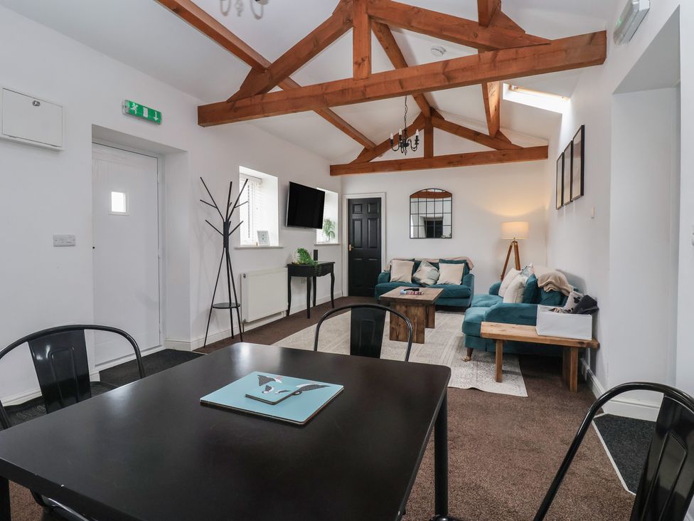 A living room with a sofa and coffee table at Gannet in Flamborough