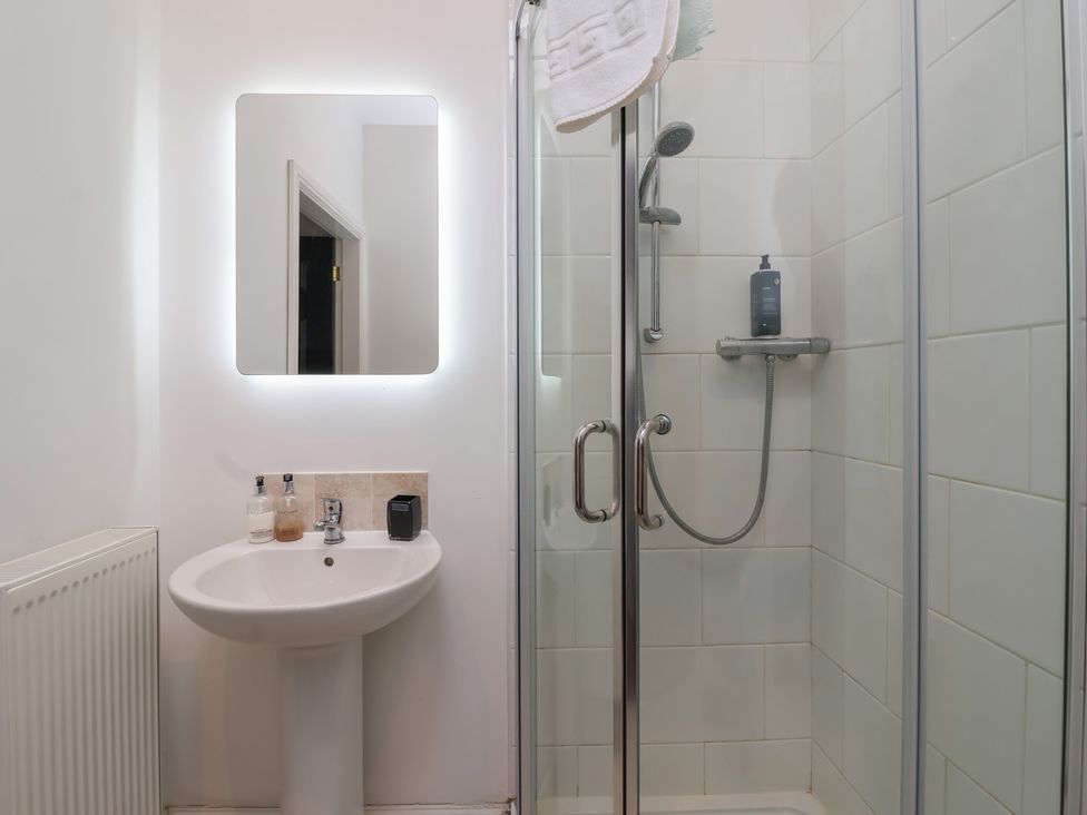 A bathroom featuring a shower and sink at Gannet in Flamborough