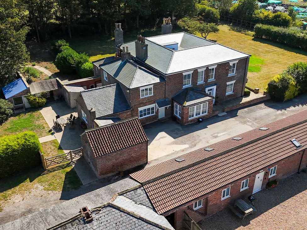 An aerial view of a house with surrounding garden and outbuildings at Gannet in Flamborough
