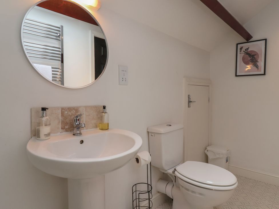 A bathroom with a sink and toilet at Razorbill in Flamborough