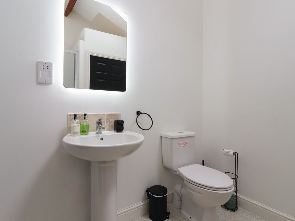 A bathroom with a sink and toilet at Puffin in Flamborough