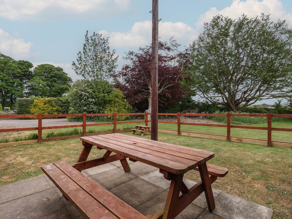 A picnic table in a garden at Puffin in Flamborough