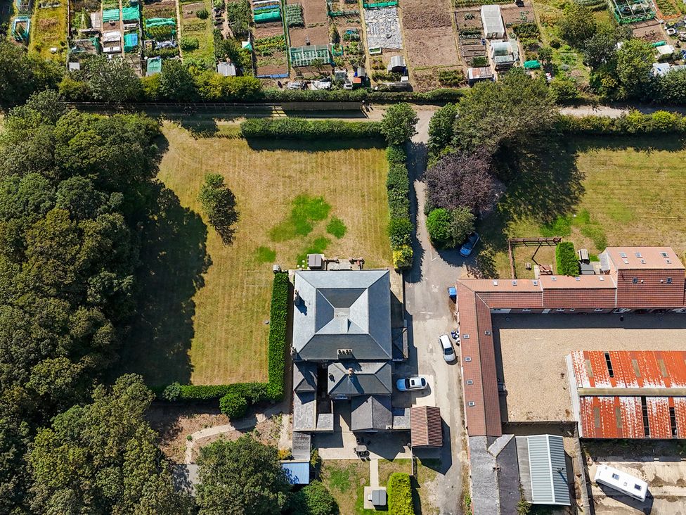 An aerial view of a house with a large garden and vegetable plots at Kittiwake in Flamborough