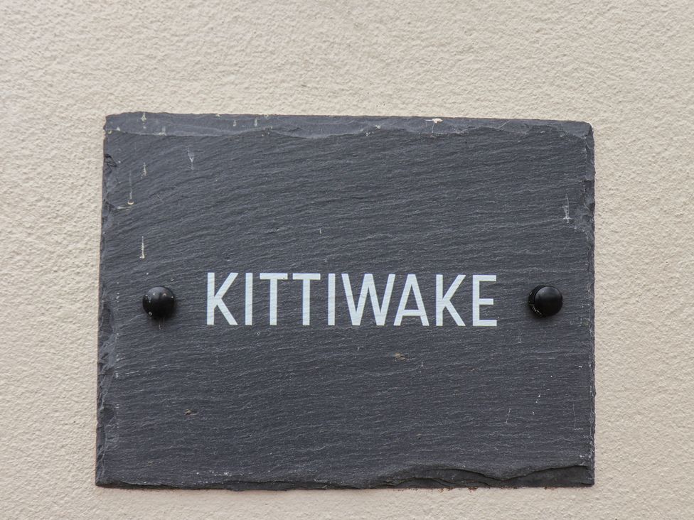 A nameplate with Kittiwake displayed on a slate at Kittiwake in Flamborough