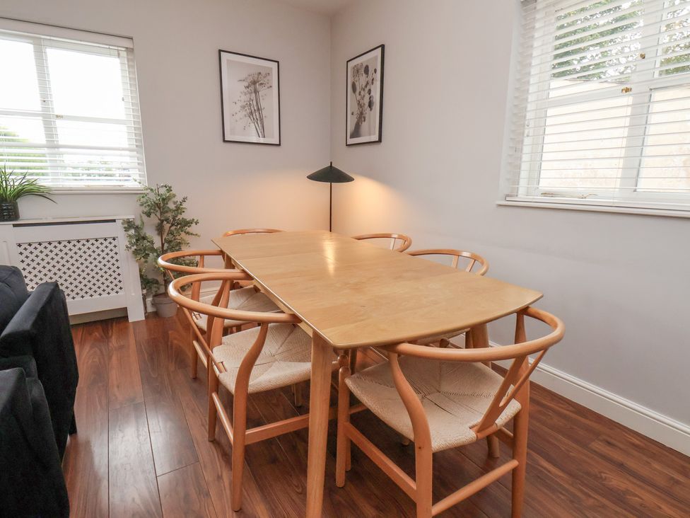 A dining room with a table and chairs at The Pheasantry in Flamborough