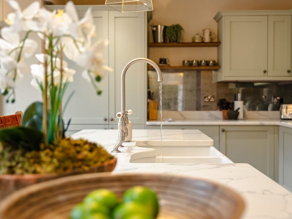 A kitchen with a sink and faucet at 3 Olivers View in Brandsby