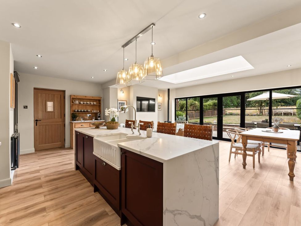 A kitchen with an island and dining area at 3 Olivers View in Brandsby