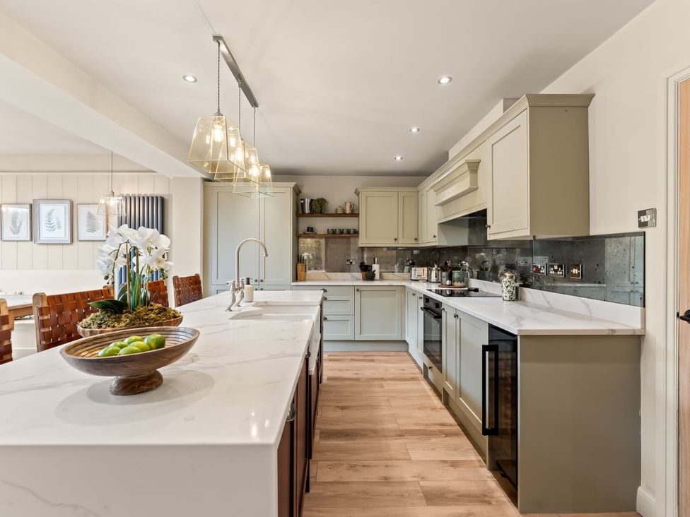 A kitchen with countertops and appliances at 3 Olivers View in Brandsby