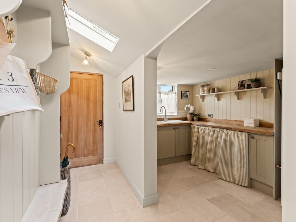 A kitchen with cabinets and a sink at 3 Olivers View in Brandsby