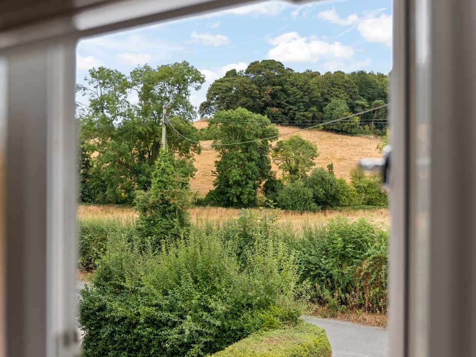 A view of trees and fields from a window at 3 Olivers View Brandsby
