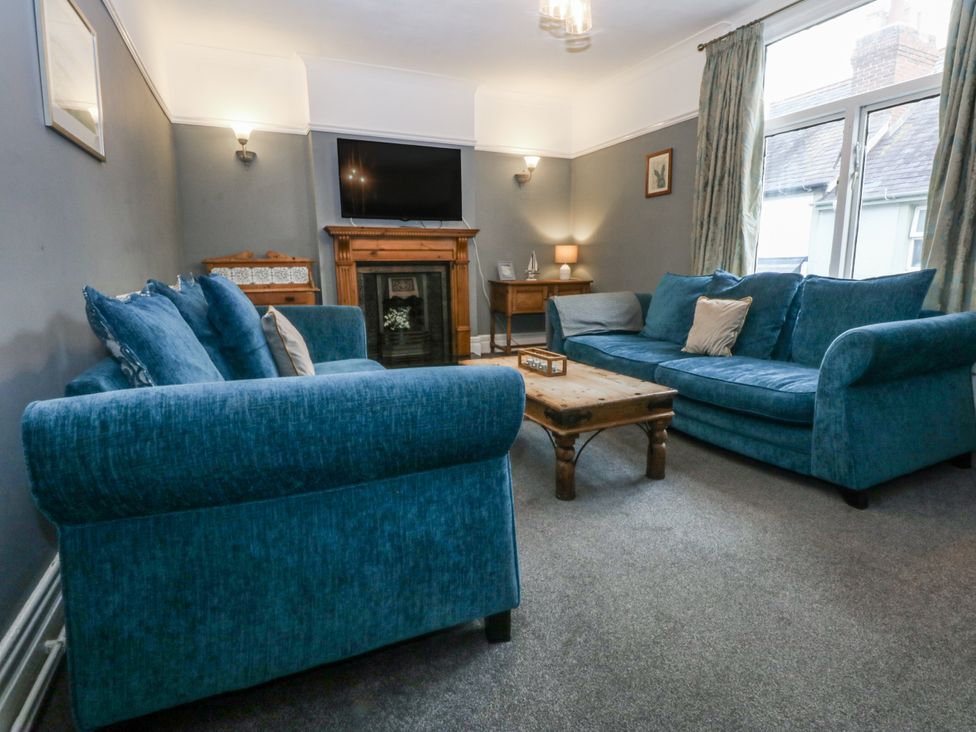 A living room with a sofa and coffee table at Penrhyn Arms Apartment in Llandudno