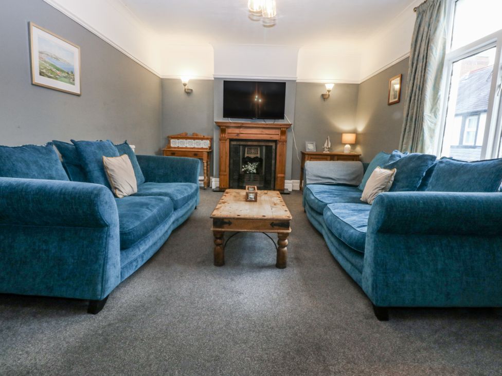 A living room with sofas and a coffee table at Penrhyn Arms Apartment in Llandudno