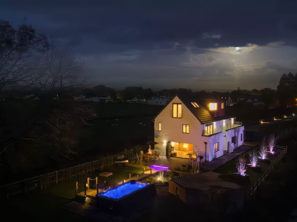 A house with a swimming pool and patio at Station House in Highbridge