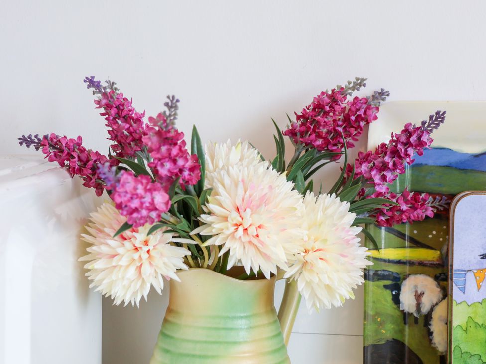 A vase with artificial flowers at Hawthorn Cottage in Silpho near Scalby