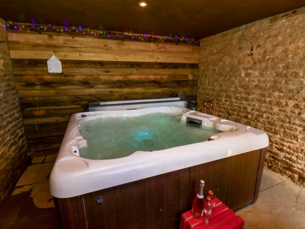 A hot tub in a spa area at Hawthorn Cottage in Silpho near Scalby