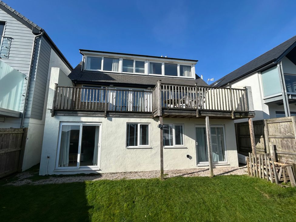 A house with a balcony and garden at Firm Anchor in Salcombe