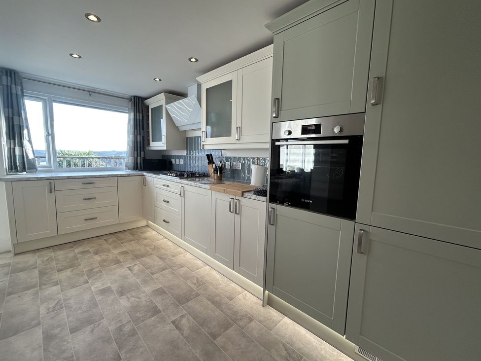 A kitchen with cabinets and countertop at Firm Anchor in Salcombe