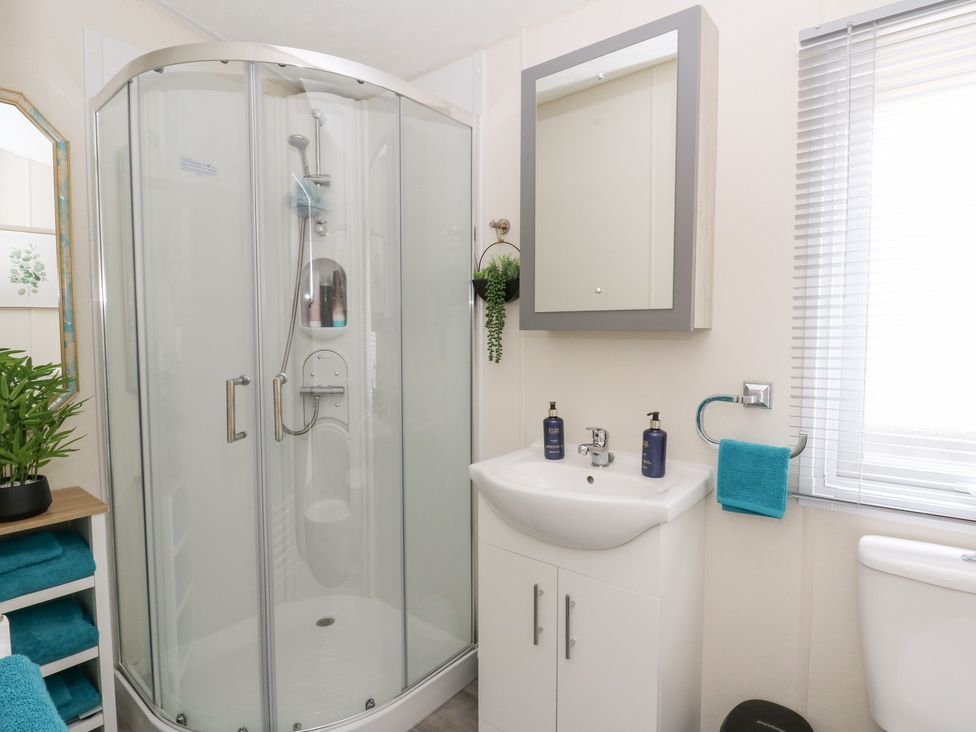 A bathroom with a shower and sink at The Haven 