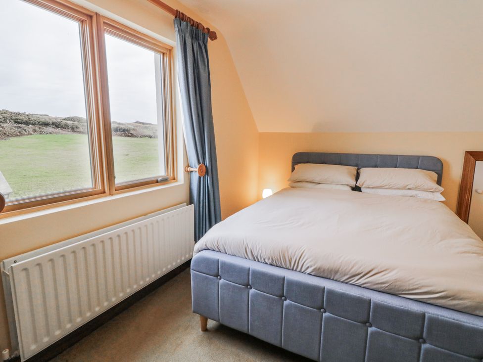 A bedroom with a bed and window at Cashelrehine Falcarrheh