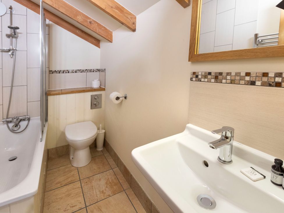 A bathroom with a bathtub, toilet, and sink at Deerpark Classic Silver Birch Deerpark Forest