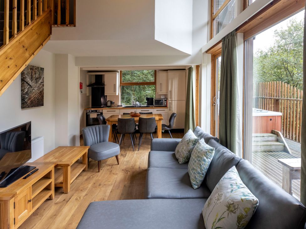 A living room with a dining area and kitchen at Deerpark Classic Silver Birch Deerpark Forest