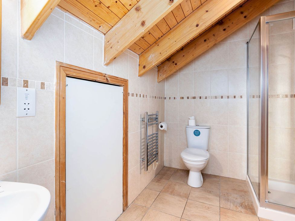 A bathroom with a shower and toilet at Strathyre Classic Silver Birch Strathyre, Ben Ledi