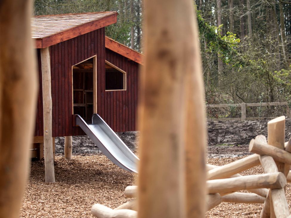 A playhouse with a slide at Delamere Forest Golden Oak Hideaway, Delamere Forest