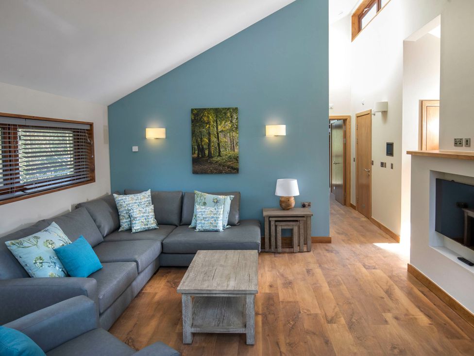 A living room with a sofa and coffee table at Cropton Silver Birch in Cropton Forest