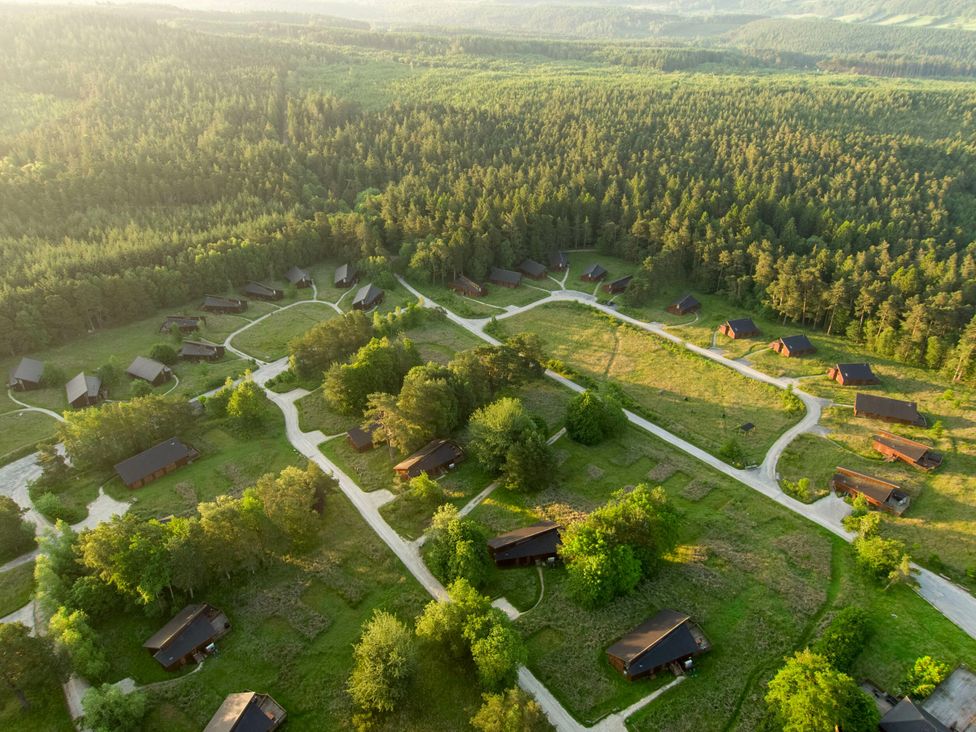 Aerial view of cabins and forest at Cropton Golden Oak in Cropton Forest