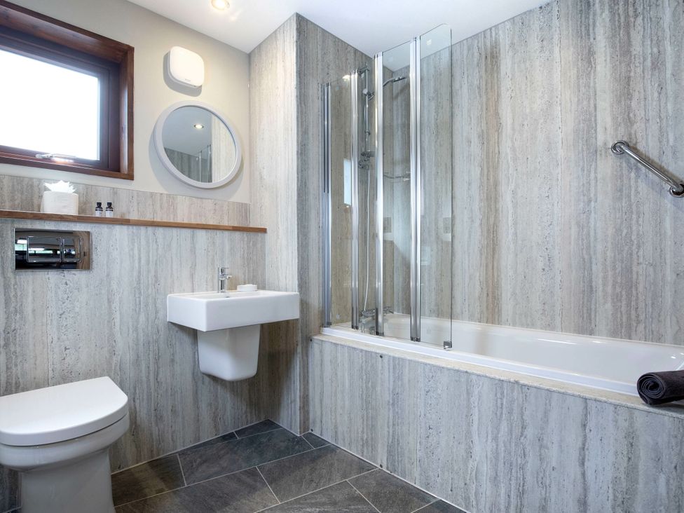 A bathroom with a toilet sink shower and bathtub at Delamere Forest Golden Oak Delamere Forest