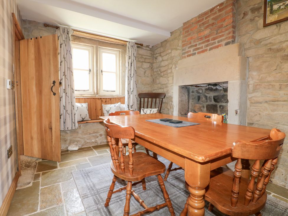 A dining room with a table and chairs at 33 Main Road Higham Derbyshire