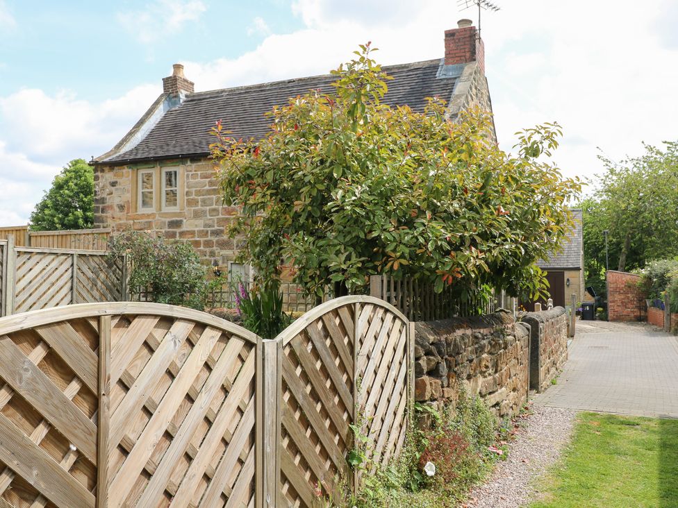 A house with a garden and fence at 33 Main Road in Higham Derbyshire