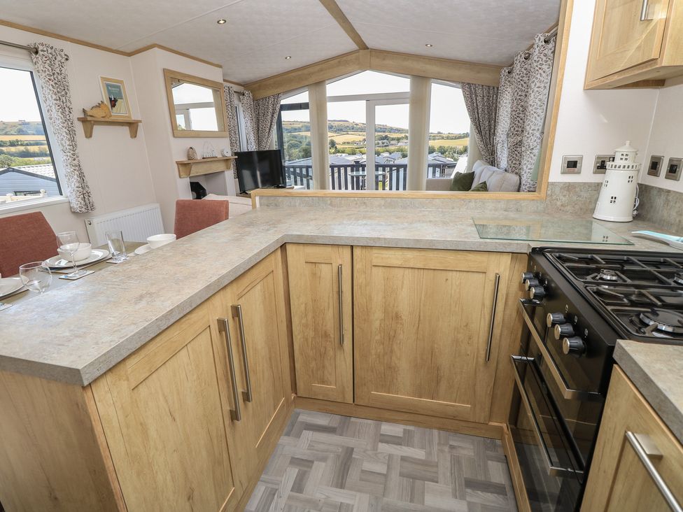 A kitchen with a countertop and stove at 31 Crosswinds in Bembridge