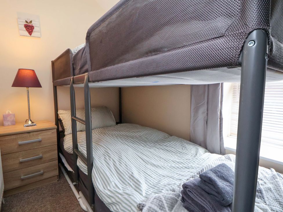 A bedroom with a bunk bed and drawer at Hill View in Bala