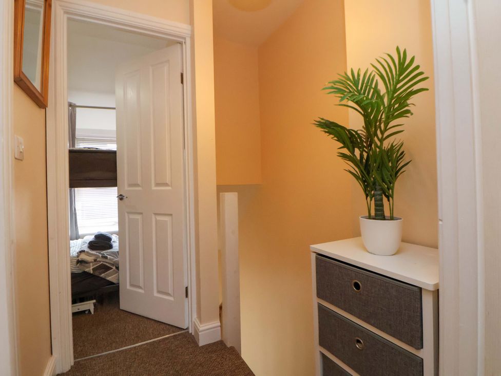 A hallway with a plant and storage unit at Hill View in Bala