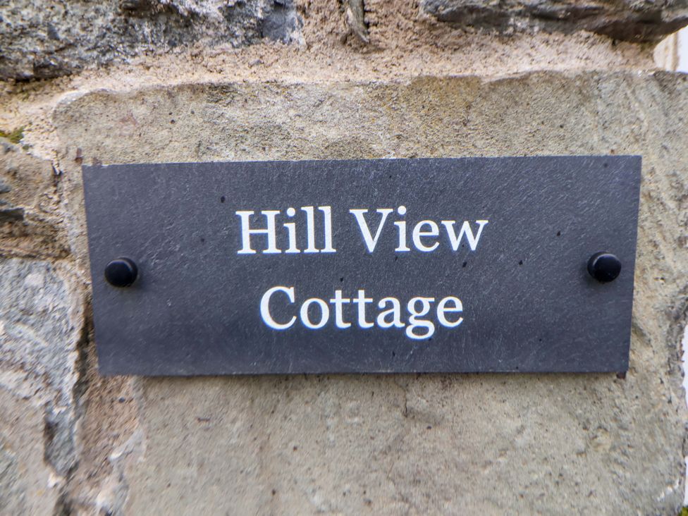A plaque showing the name Hill View Cottage