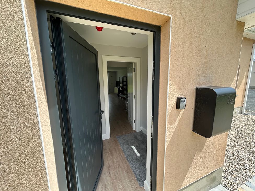 An entrance with an open front door and mailbox at 30 River Run in Belturbet, County Cavan