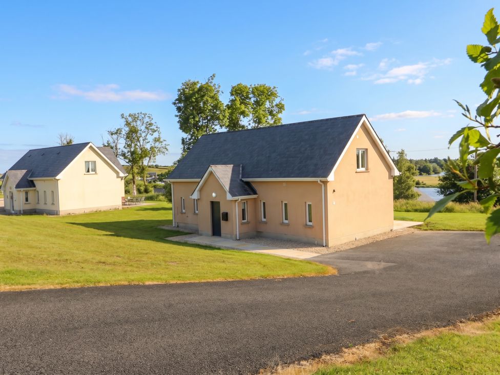 A house with a driveway and grass at 30 River Run, Belturbet, County Cavan