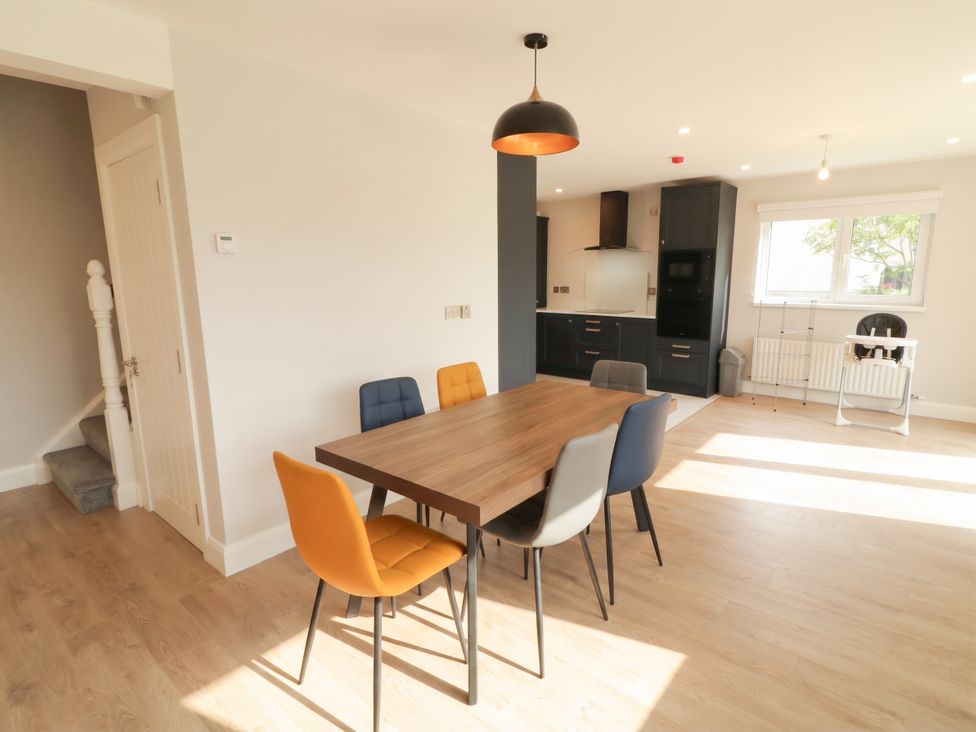 A dining room with a table and chairs at 30 River Run, Belturbet, County Cavan