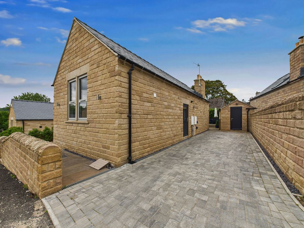 An outdoor view of a property with a driveway at Oakwood Lodge in Tansley