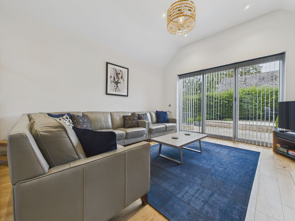 A living room with a sofa and coffee table at Oakwood Lodge in Tansley