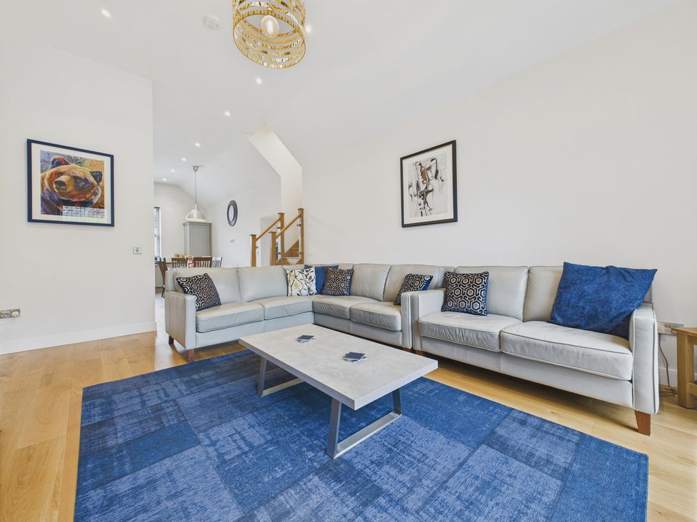 A living room with a sofa and coffee table at Oakwood Lodge in Tansley