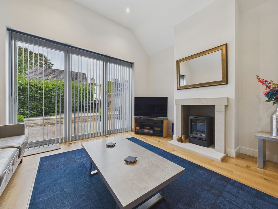 A living room with a sofa and coffee table at Oakwood Lodge Tansley