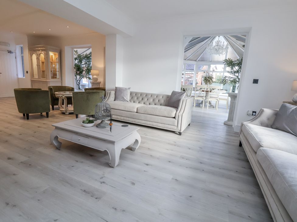A living room with a coffee table and sofas at The House at School Farm in Hassall near Haslington
