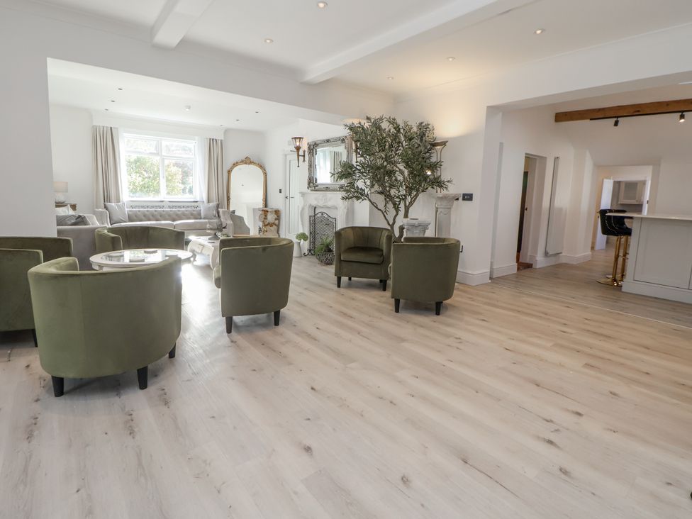 A living room with chairs and a sofa at The House at School Farm in Hassall near Haslington