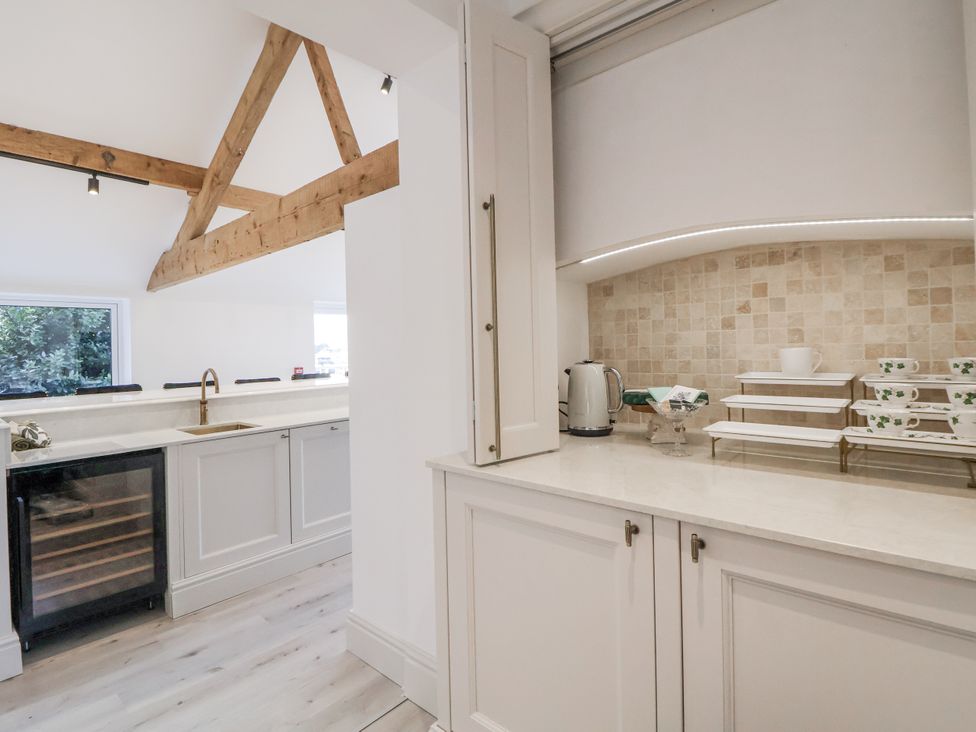 A kitchen with a sink and kettle at The House at School Farm in Hassall near Haslington