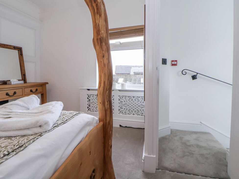 A bedroom with a bed and dresser at The House at School Farm in Hassall near Haslington