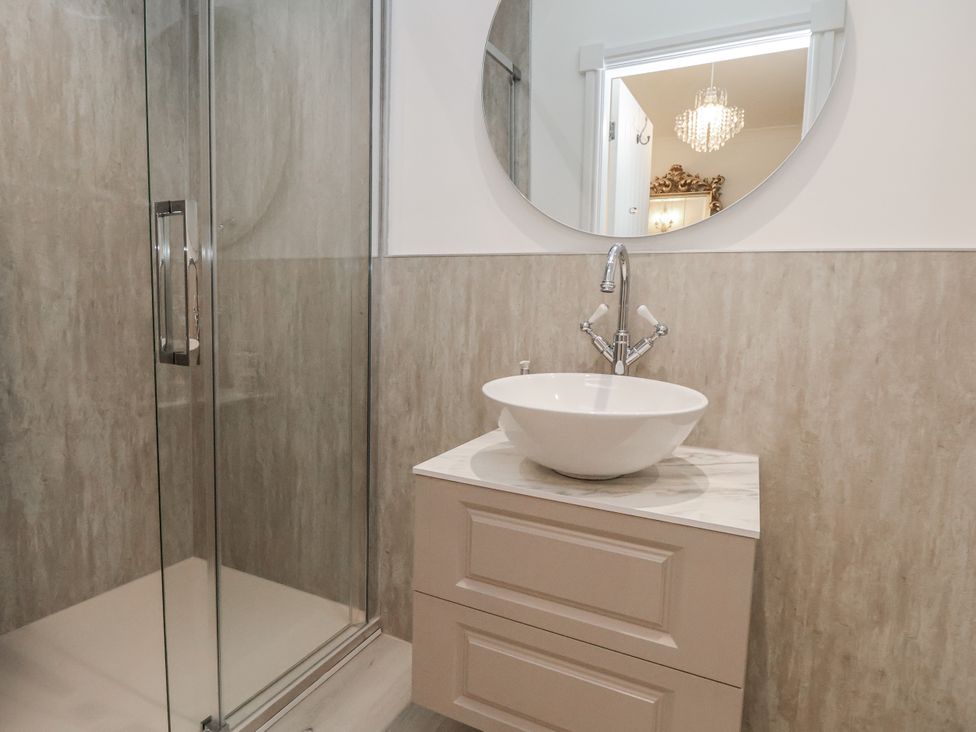 A bathroom with a shower and a sink at The House at School Farm in Hassall near Haslington