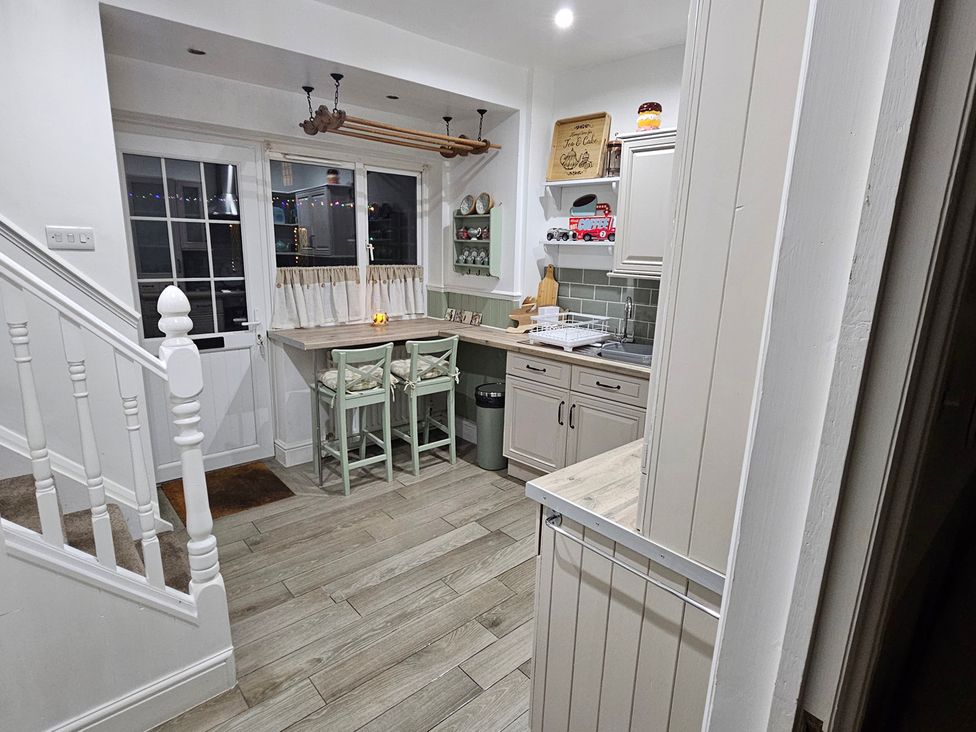 A kitchen with a sink and countertop at Twisted Chimney View in Alford